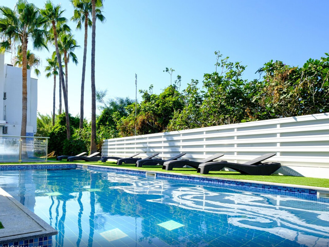 фотографии отеля Sanders Rio Gardens - Adorable 1-bedroom Apartment With Shared Pool & Balcony изображение №7